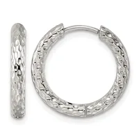 A pair of silver hoop earrings with a textured, dimpled surface pattern shown from front and side views.