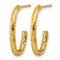 A pair of gold hoop earrings with a textured, dimpled surface finish displayed against a white background.