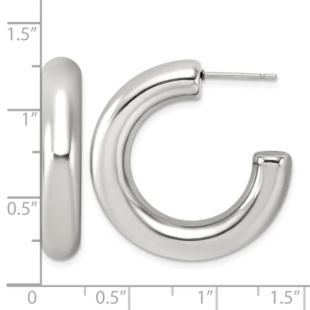 Polished silver-toned chunky curved hoop earrings displayed against a measurement scale showing approximately 1.5 inches in height and 0.5 inches in width.