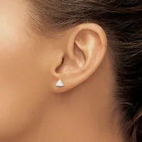 A person wearing a small white triangular stud earring in their earlobe, shown in profile view against their skin tone.