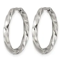 Pair of twisted silver hoop earrings with a textured finish and hinged closures, shown against a white background.