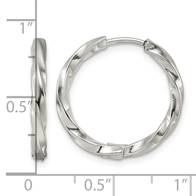 Silver twisted hoop earrings with hinged closures, shown from front and side views with measurement scale indicating approximately one inch in diameter and half inch in width.