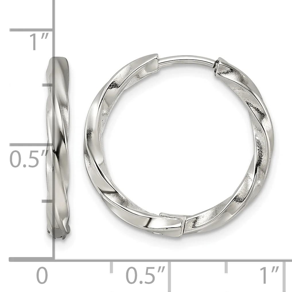 Silver twisted hoop earrings with hinged closures, shown from front and side views with measurement scale indicating approximately one inch in diameter and half inch in width.