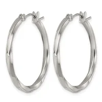 A pair of polished silver-toned hoop earrings with a twisted surface finish and hinged closures, displayed against a white background.
