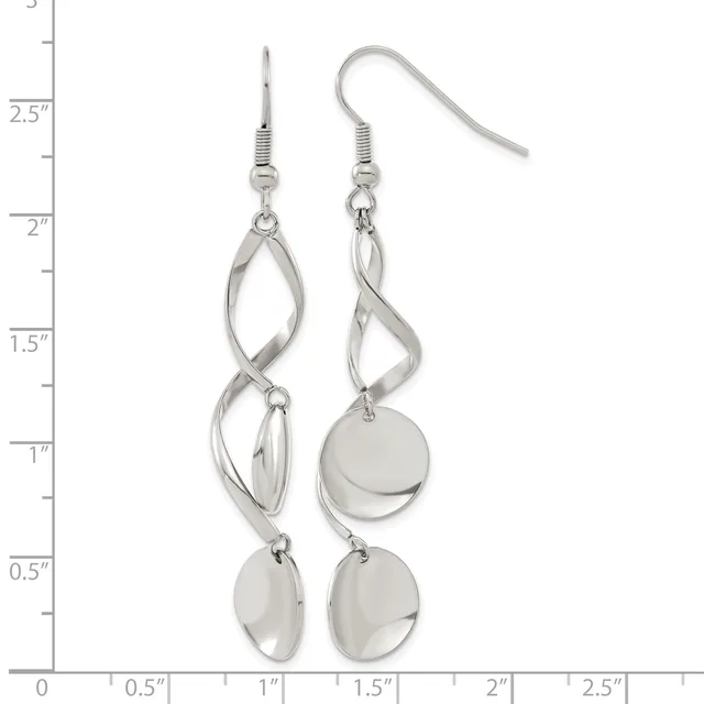 A pair of silver-tone dangle earrings with twisted oval loops above polished disc charms, displayed on a measurement ruler.
