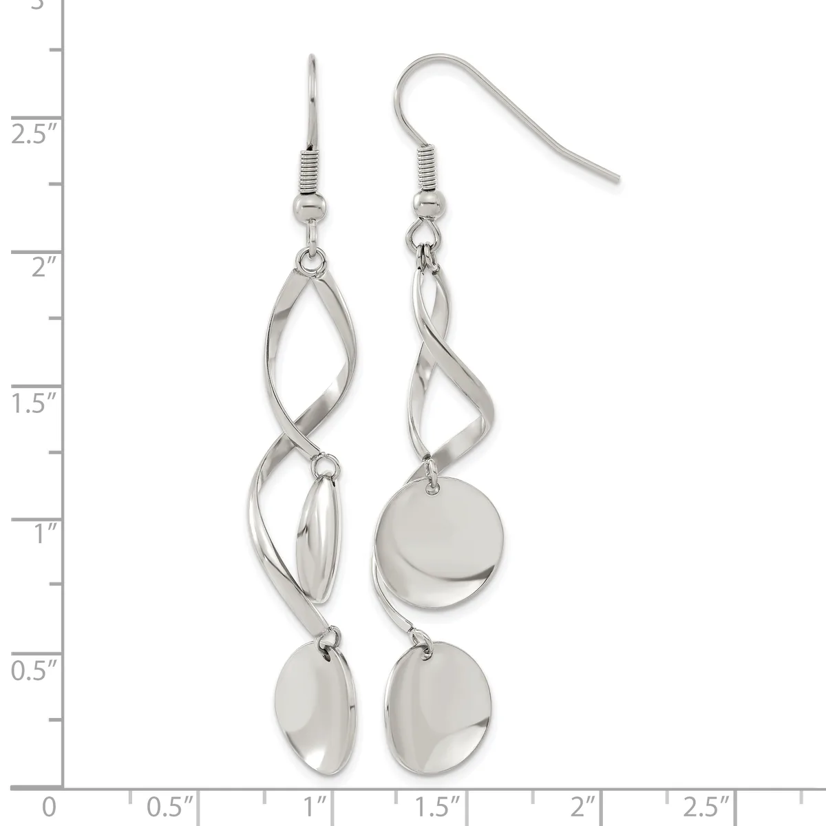 A pair of silver-tone dangle earrings with twisted oval loops above polished disc charms, displayed on a measurement ruler.