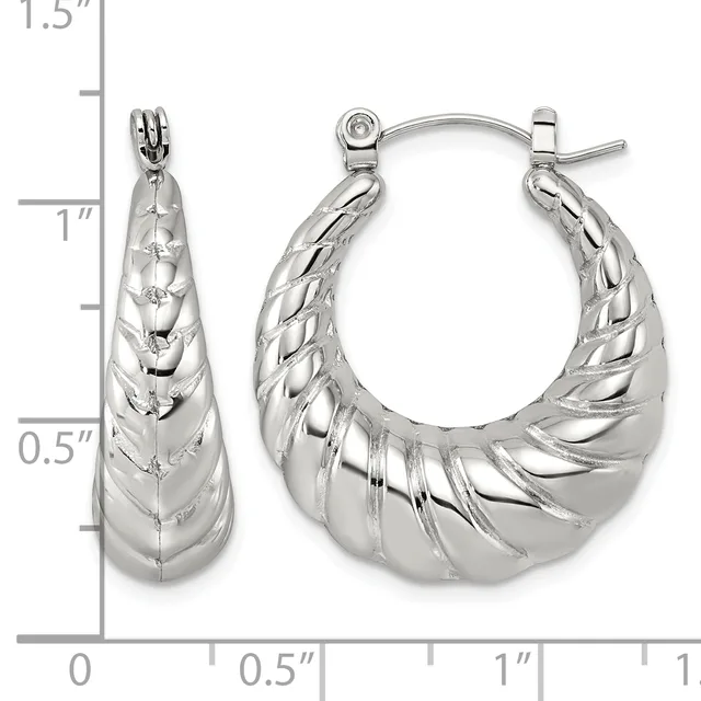 Pair of polished silver-tone twisted tapered hoop earrings with hinged posts, shown next to a measurement scale indicating approximately one inch in length.