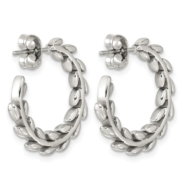 A pair of silver-toned twisted hoop earrings with leaf-shaped segments arranged in a braided pattern, shown from the front against a white background.