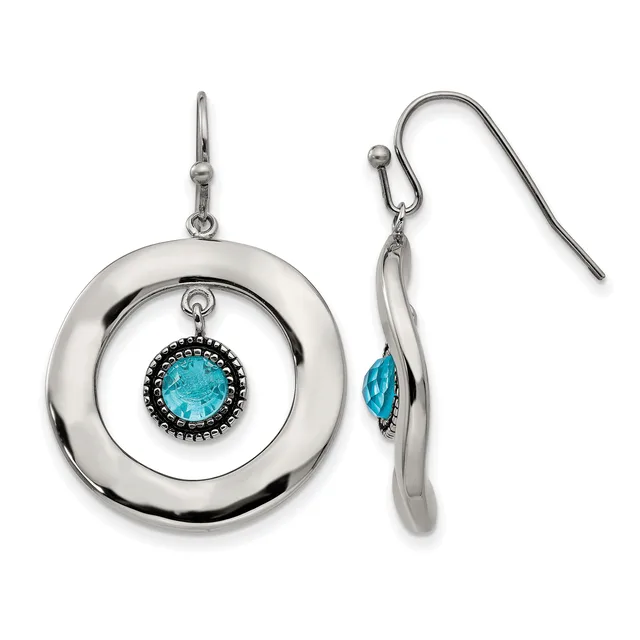 A pair of silver dangle earrings with concentric circular designs featuring turquoise gemstones surrounded by black beading, shown from front and side views.