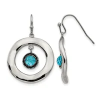 A pair of silver dangle earrings with concentric circular designs featuring turquoise gemstones surrounded by black beading, shown from front and side views.
