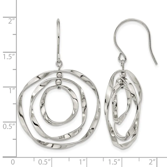Silver concentric circle dangle earrings with textured finish shown next to a ruler measuring approximately two inches in length.