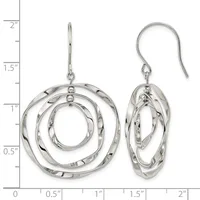 Silver concentric circle dangle earrings with textured finish shown next to a ruler measuring approximately two inches in length.