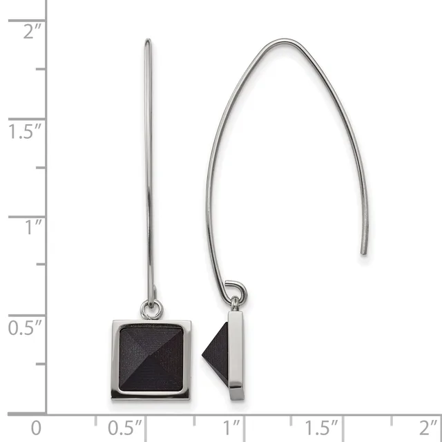 A pair of silver drop earrings with black square pendants shown against a ruler measuring approximately two inches in length.
