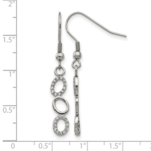 A pair of silver-tone dangle earrings with crystal-embellished oval charms and plain oval rings, displayed against a ruler showing approximately two inches in length.