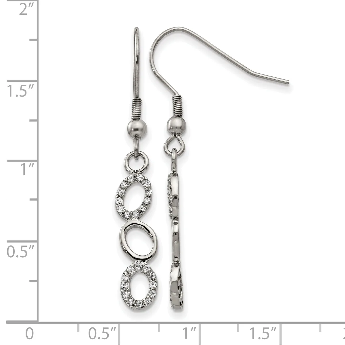 A pair of silver-tone dangle earrings with crystal-embellished oval charms and plain oval rings, displayed against a ruler showing approximately two inches in length.
