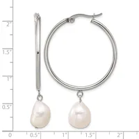 Silver hoop earrings with freshwater pearl drops, shown next to a measurement scale indicating approximately 1.5 inches in length.