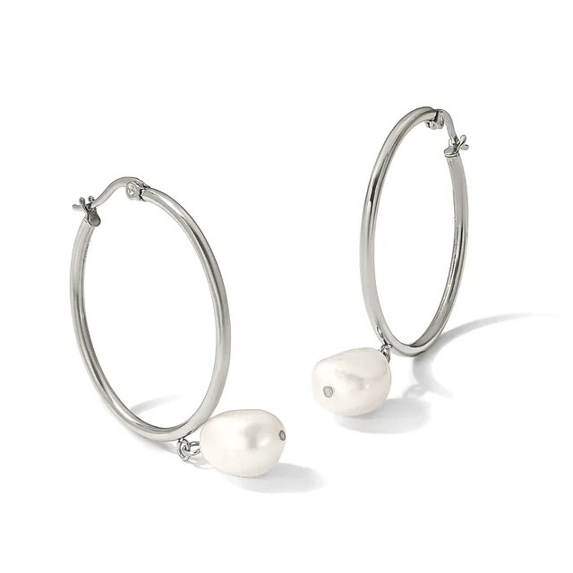 Pair of silver-toned hoop earrings with white pearl charms hanging from the bottom, displayed against a white background.