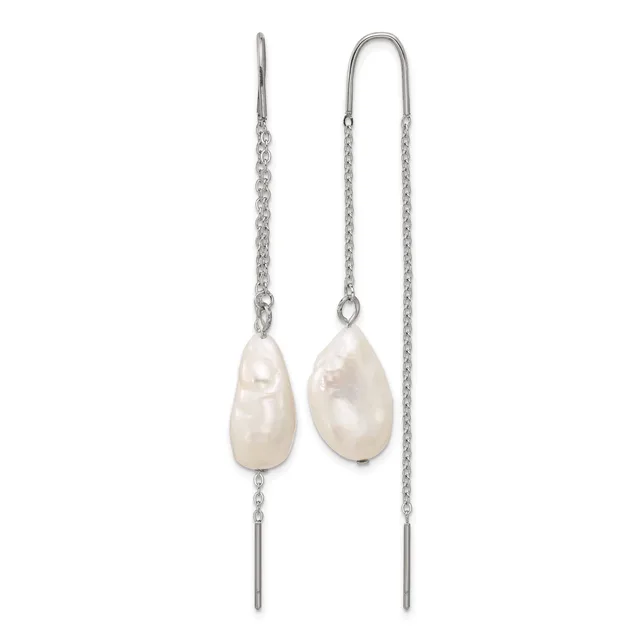 A pair of silver threader earrings with white pearl teardrop pendants suspended from delicate chains.