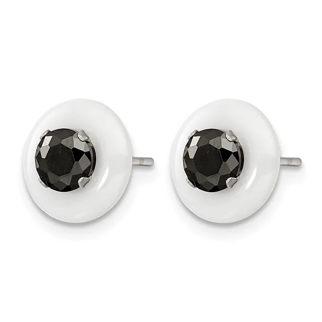 A pair of round white ceramic stud earrings with faceted black gemstones set in the center, displayed against a white background.