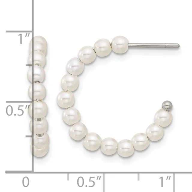 Pearl stud and hoop earrings displayed next to a measurement ruler showing approximately one inch in length.