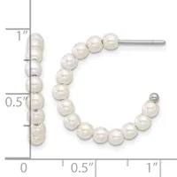 Pearl stud and hoop earrings displayed next to a measurement ruler showing approximately one inch in length.