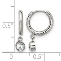 A pair of silver hoop earrings with detachable charms, one featuring a round cubic zirconia stone and the other a polished silver cylinder, shown next to a measurement scale.