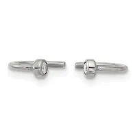 Pair of silver cufflinks with oval-shaped crystal or diamond centers set in cylindrical bezels, shown from front and back views.