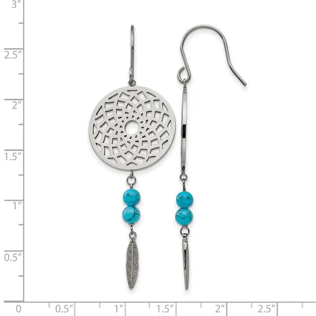 Two silver earrings with openwork circular disc tops, turquoise bead accents, and dangling leaf charms, shown against a measurement scale.