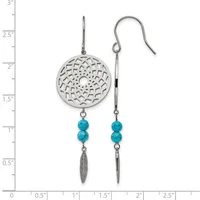 Two silver earrings with openwork circular disc tops, turquoise bead accents, and dangling leaf charms, shown against a measurement scale.