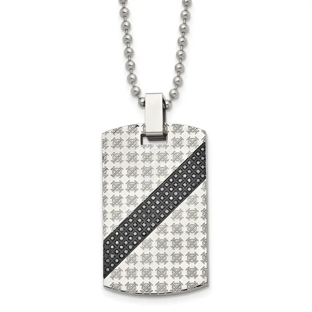 A stainless steel dog tag pendant with repeating geometric pattern and a black diagonal stripe with crystal accents, suspended from a ball chain necklace.