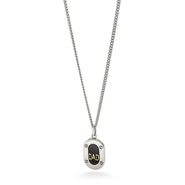 Silver pendant necklace with rectangular charm featuring black oval center engraved with "DAD" in gold lettering, suspended from a thin chain.