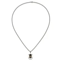 Silver-toned chain necklace with a rectangular pendant featuring a black oval stone or enamel center and small decorative corner details.