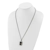 Silver-toned chain necklace with a small rectangular black pendant featuring a stamped hallmark, displayed on a white mannequin bust.