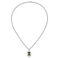 Silver-toned chain necklace with a small oval pendant featuring black enamel and gold lettering, displayed against a white background.