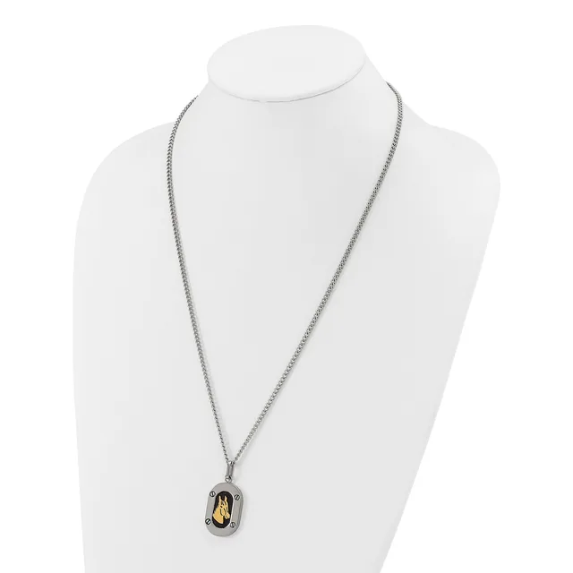 A two-tone pendant necklace with a silver chain and an oval-shaped charm featuring a golden stone or inlay, displayed on a white mannequin bust.