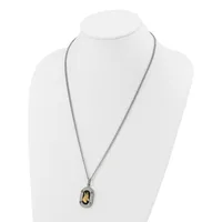 A two-tone pendant necklace with a silver chain and an oval-shaped charm featuring a golden stone or inlay, displayed on a white mannequin bust.