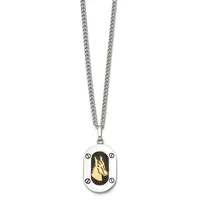 Silver-toned chain necklace with a rectangular pendant featuring a black oval stone or enamel with a gold-colored leaf design and small screw-like details around the border.