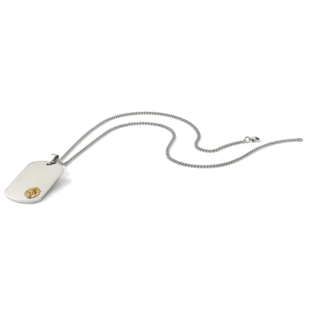 A silver chain necklace with a rectangular white pendant featuring a small gold circular detail.