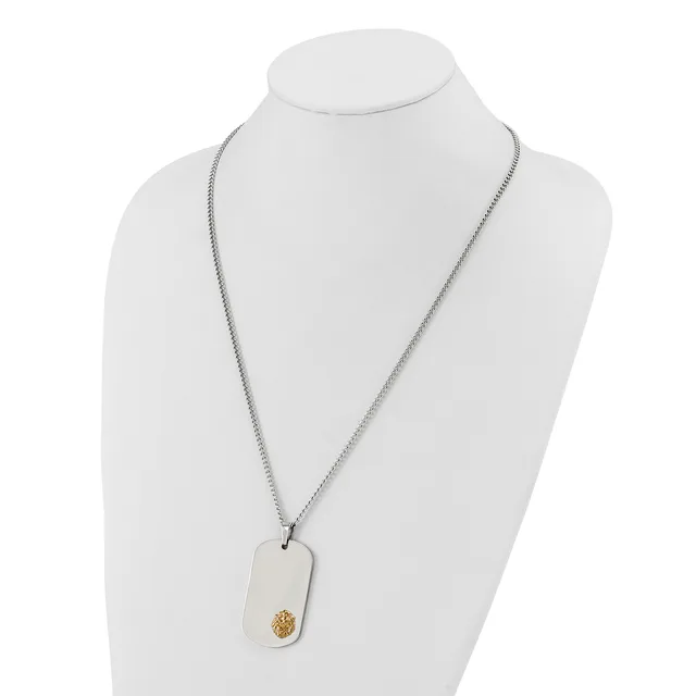Silver-toned chain necklace with a rectangular white pendant featuring a small gold-colored circular detail, displayed on a white mannequin bust.