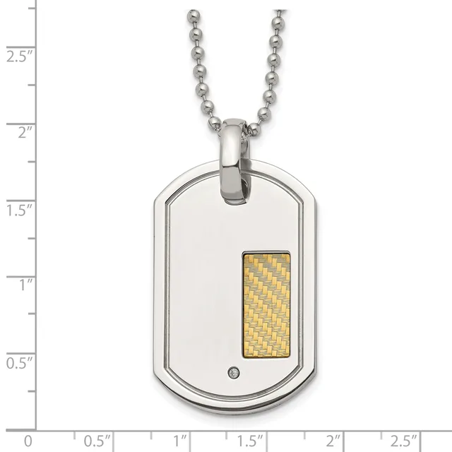 A stainless steel dog tag pendant with a gold-toned woven rectangular inlay and small diamond accent, suspended from a ball chain, shown against a measurement scale.