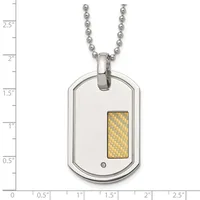 A stainless steel dog tag pendant with a gold-toned woven rectangular inlay and small diamond accent, suspended from a ball chain, shown against a measurement scale.