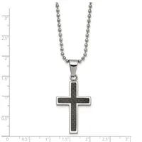 A stainless steel ball chain necklace with a cross pendant featuring a dark carbon fiber inlay, displayed on a measurement scale.