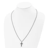 A silver-toned chain necklace with a small cross pendant displayed on a white mannequin bust.