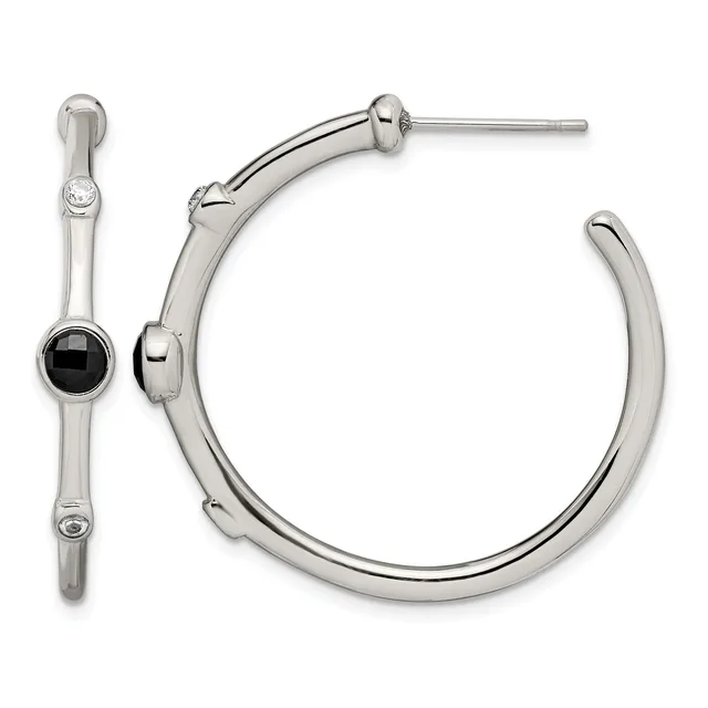 A pair of silver-tone hoop earrings, one featuring a black onyx stone accent, displayed against a white background.