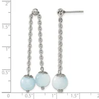 A pair of silver chain dangle earrings with light blue spherical stones, displayed against a ruler showing measurements up to two inches.