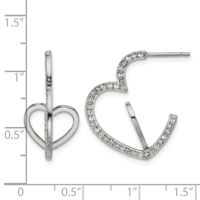 A pair of silver-toned earrings displayed on a measurement ruler: one heart-shaped stud earring on the left and one curved hoop earring set with rhinestones on the right.