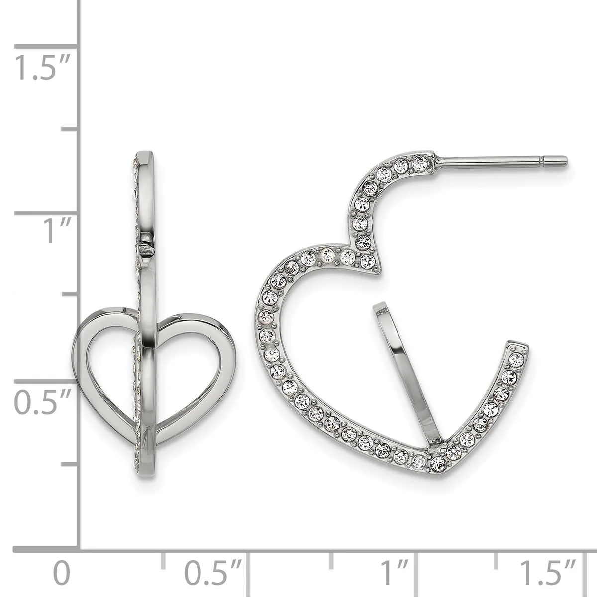 A pair of silver-toned earrings displayed on a measurement ruler: one heart-shaped stud earring on the left and one curved hoop earring set with rhinestones on the right.