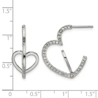 A pair of silver-toned earrings displayed on a measurement ruler: one heart-shaped stud earring on the left and one curved hoop earring set with rhinestones on the right.