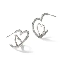 A pair of silver-toned heart-shaped hoop earrings with crystal embellishments along the outer edges, shown from front and side angles.