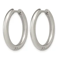 A pair of polished silver-toned chunky hoop earrings with hinged closures, displayed side by side against a white background.